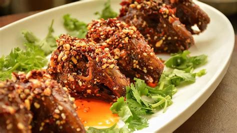   Spicy Sichuan Rabbit Head Stews Itself with Aromatic Herbs and Umami-Rich Broth!